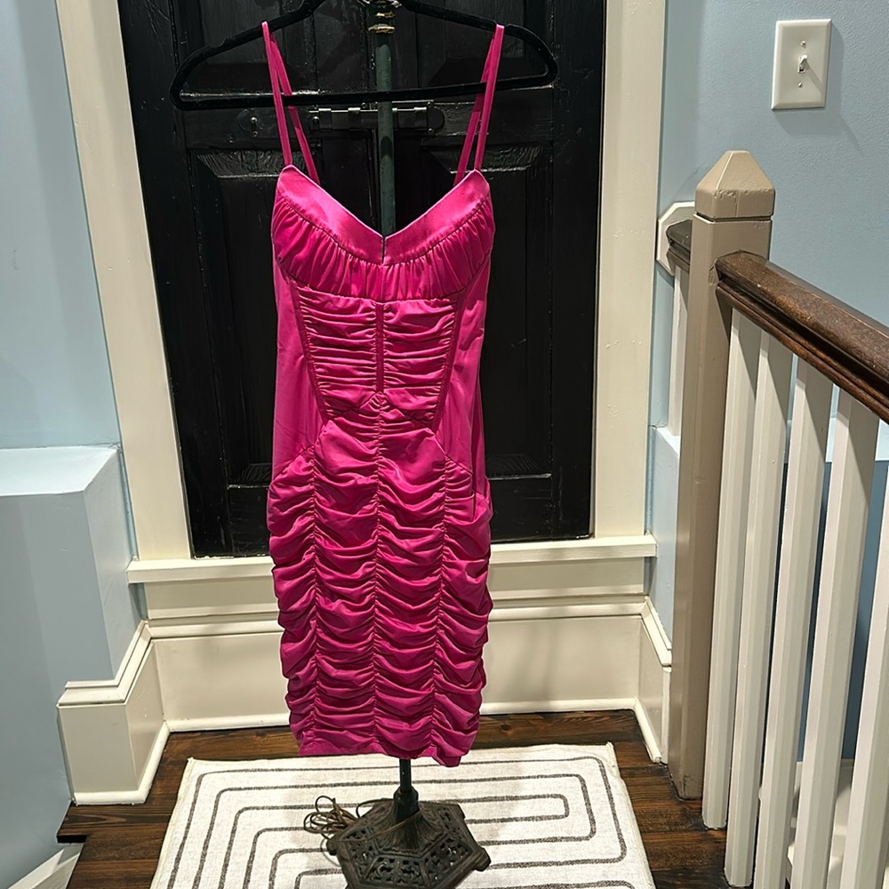 Figure hugging below the knee hot pink dress